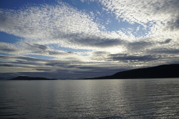 Beautiful sky over the fjords in Norway. Summer. June. Time for white nights. HDR light.
