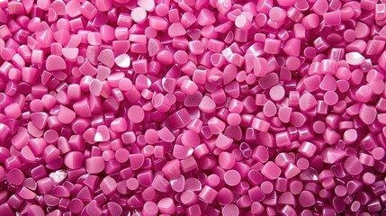 Obraz premium Pink polymer granules for creating banner backgrounds in plastic company catalog photos