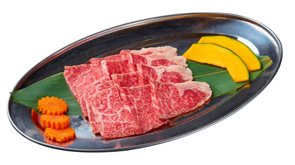 Sliced Beef is beautifully arranged with vegetables (Sliced pumpkin and carrots) served on a stainless steel tray isolated on white background.