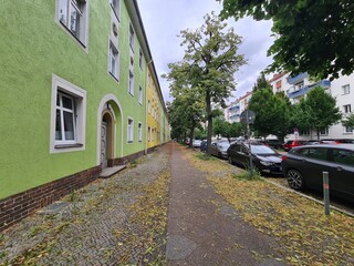 sidewalk view with houses to the left in Berlin Treptow/Köpenick