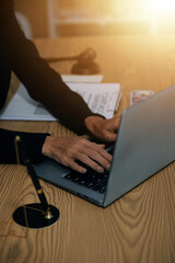 Judge gavel with Justice lawyers having team meeting at law firm background. Concepts of Law and Legal services.