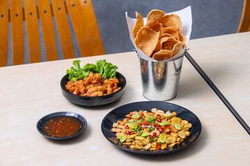 Popular snacks in the restaurant at Thailand. Peanut with salt, Crisp rice, Deep fried chicken tendons.