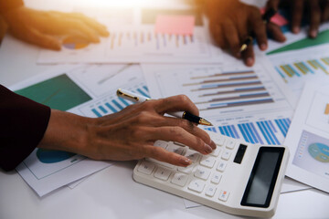 Fund managers team consultation and discuss about analysis Investment stock market at office