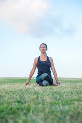 A Young woman doing yoga exercise outdoor