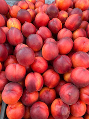 Fresh nectarines at the farmers market background