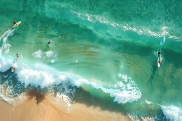 Obraz premium A group of surfers are riding waves in the ocean