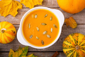 Healthy vegetarian autumn pumpkin soup . Diet food background .