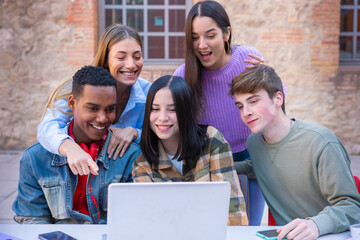 Group of students, meet on university campus work together on creative tasks, prepare for university exams, use laptop. Education, study of university life concept.