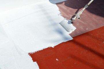 Waterproofing the house terrace with white rubber waterproof coating paint. Waterproof Anti-Leaking Sealant paint
