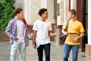 Students going to classes, having break outdoors and chatting