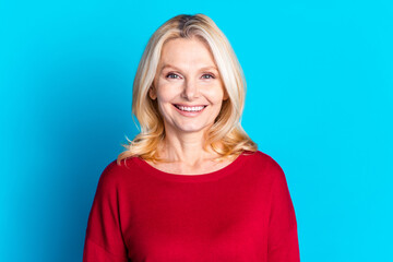 Fototapeta premium Photo portrait of attractive retired woman look camera smile dressed stylish red clothes isolated on blue color background