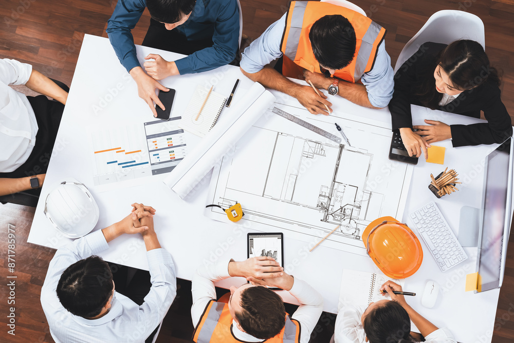 Poster Top view banner of diverse group of civil engineer and client working together on architectural project, reviewing construction plan and building blueprint at meeting table. Prudent