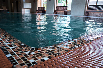 Mosaic underwater in the pool. Part of the pool. Rest in the SPA. Selective focus