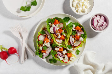 healthy sweet potato lettuce boats with radish, feta cheese, lentils