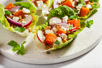 healthy sweet potato lettuce boats with radish, feta cheese, lentils