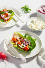 healthy sweet potato lettuce boats with radish, feta cheese, lentils