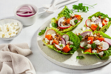 healthy sweet potato lettuce boats with radish, feta cheese, lentils