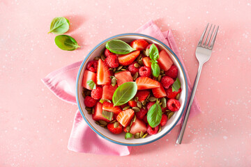 watermelon salad with strawberry raspberry basil seeds. healthy summer dessert