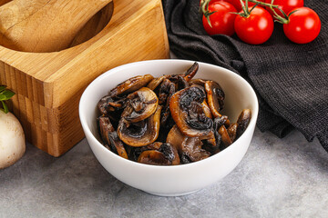 Roasted champignon mushrooms in the bowl