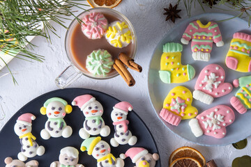 Christmas marshmallows. Winter candy. Sweet food in december. Snowman and Santa Claus