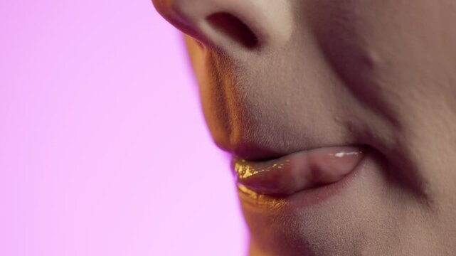 Close Up Of Woman's Mouth Tasting Lollipop Candy And Licking Lips With Tongue, Studio Shot