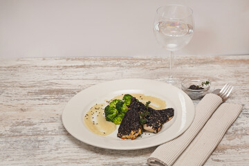 Black Sesame Seed Chicken Fillets With Broccoli and Mash Potatoes Served