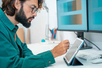 Man working with computer digital tablet at modern office. High quality photo