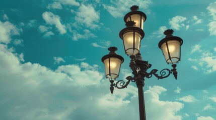 Vintage street lantern against cloudy sky with three lamps on pole Blank space included