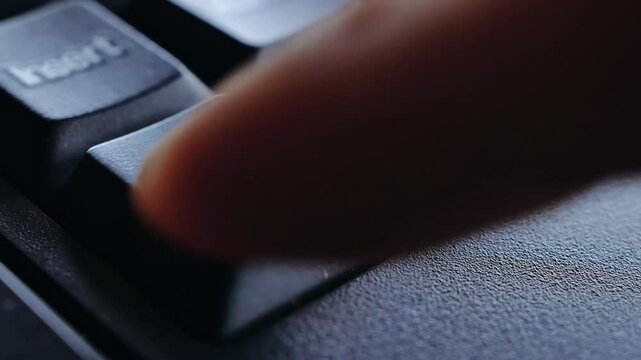 Close-up of finger press a key on the keyboard Delete , Macro shot of finger pressing Delete button on keyboard, Keyboard button Delete