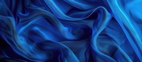 Obraz premium Background with a blue fabric texture providing copy space image.