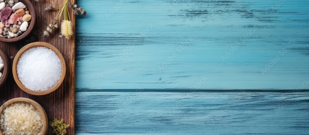 Poster top-down display of a spa collection with essential oils, sea salt, and clay scrub arranged on a woo