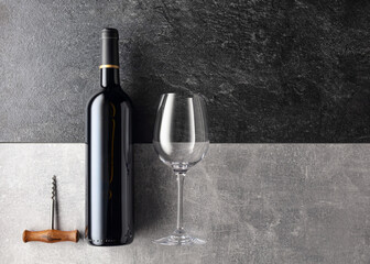 Bottle and glass of red wine.