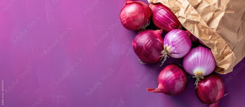 Poster Close up of red onions in a paper bag on a purple background with copy space image.