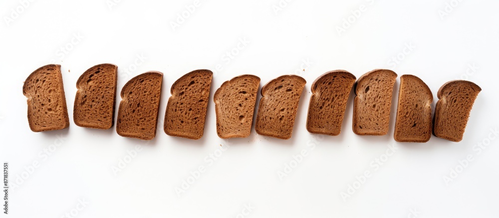 Poster top view of freshly baked rye bread slices on a white background with copy space image.