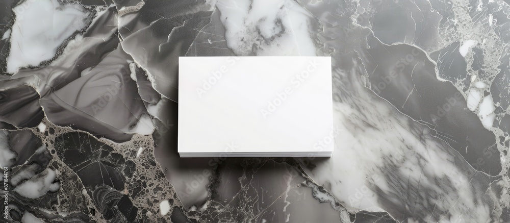 Aufkleber Blank white business cards placed on a sophisticated gray marble backdrop with clipping path for customizing designs on the cards in a copy space image.