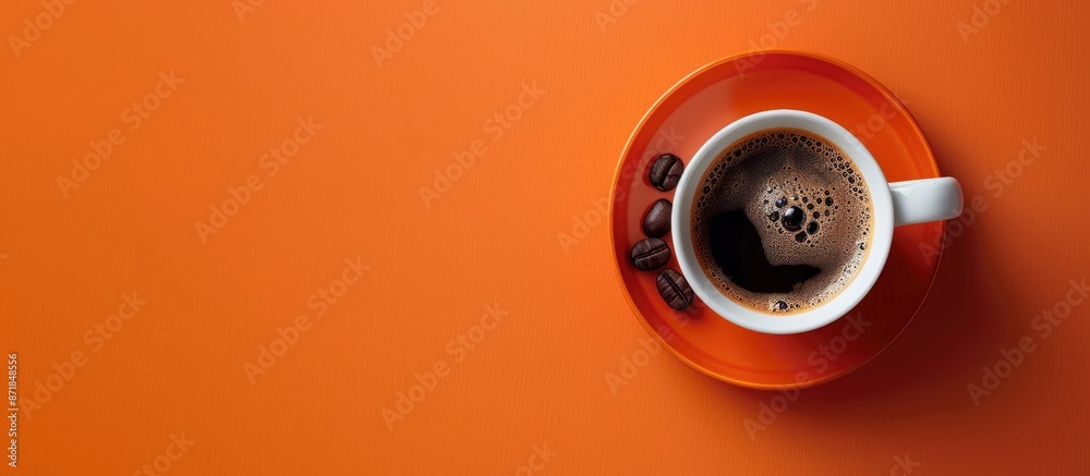 Poster Coffee cup placed on an orange backdrop with a coffee bean, creating a visually appealing copy space image.