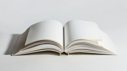 Exercise book opened on white surface with shadow