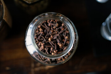 Dried clove bud in a clear glass jar Fragrant herbs, spices, medicinal properties