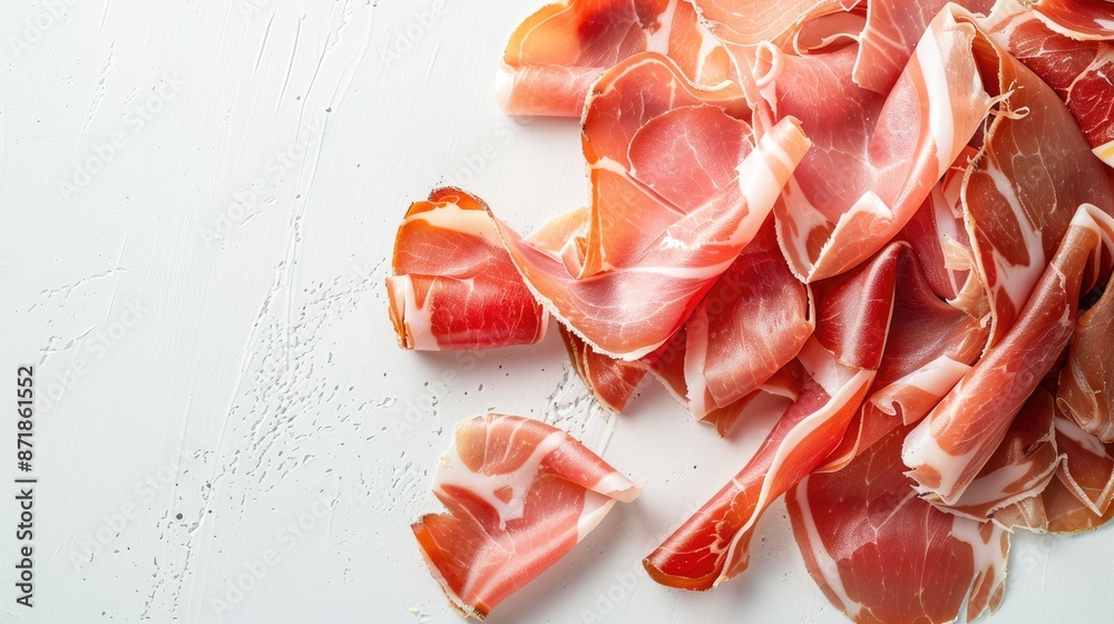 Canvas Prints Sliced prosciutto or jamon ham from above on a white background