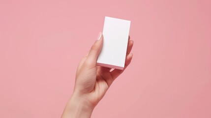 Woman s hand testing white product package representing beauty and body care industry