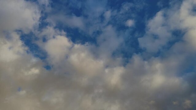 Golden altocumulus clouds move into the twilight