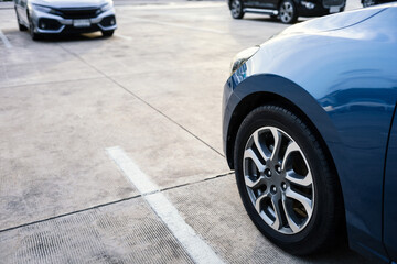 close up of modern car in parking lot, grunge surface of street, car parked in the right position in outdoor shopping plaza carpark area, shallow depth of field © happycreator