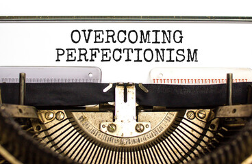 Overcoming perfectionism symbol. Concept words Overcoming perfectionism typed on beautiful old retro typewriter. Beautiful white paper background. Business Overcoming perfectionism concept. Copy space