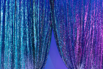 brightly colored shimmering glitter fabric enriched with light and smoke effects used as a...