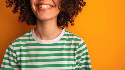 The smiling person in stripes