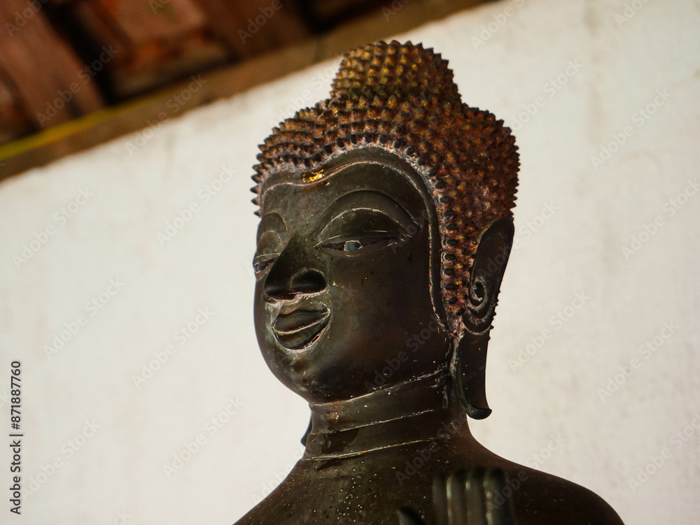 Wall mural buddha statues and sculptures at phra that luang or phra chedi lokachulamanee is considered a very i