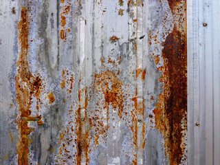 Corroded metal background. The metal walls have rust spots. Rusted metal background with rust marks, rust stains. Rystycorrosion
