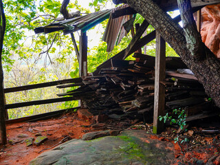 Piles of wood for repairs or construction of wooden walkway bridges on the mountain.