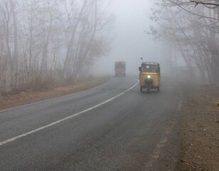 Rickshaw and Truck Driving in Heavy Fog
