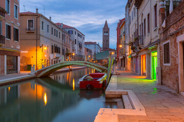 Typical Venetian canal with bridge at night, San Barnaba, Venice, Italy © Kavalenkava